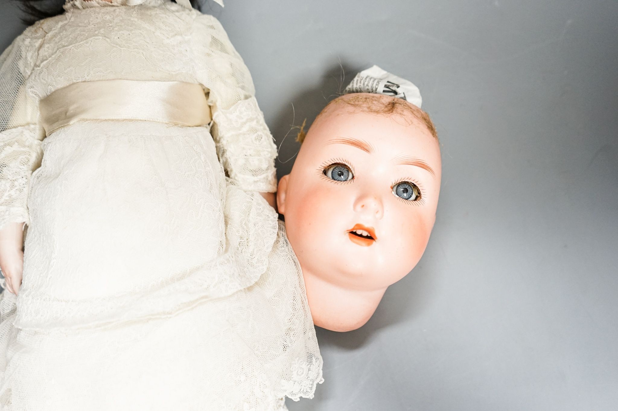 J D Kestner, bisque doll and a Schwenau & Hoffmeister bisque head